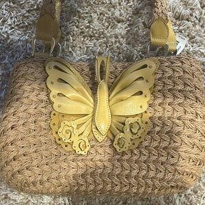 Brighton straw handbag w/leather handles & appliqué